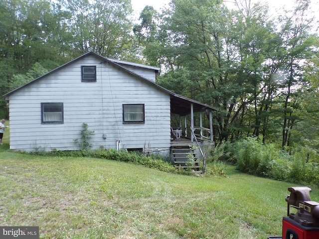 view of property exterior featuring a yard