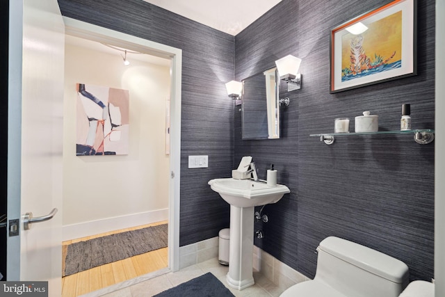 bathroom featuring tile patterned flooring and toilet