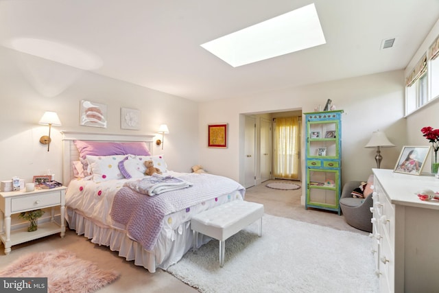 bedroom featuring carpet floors and a skylight