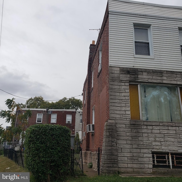 view of side of property featuring cooling unit