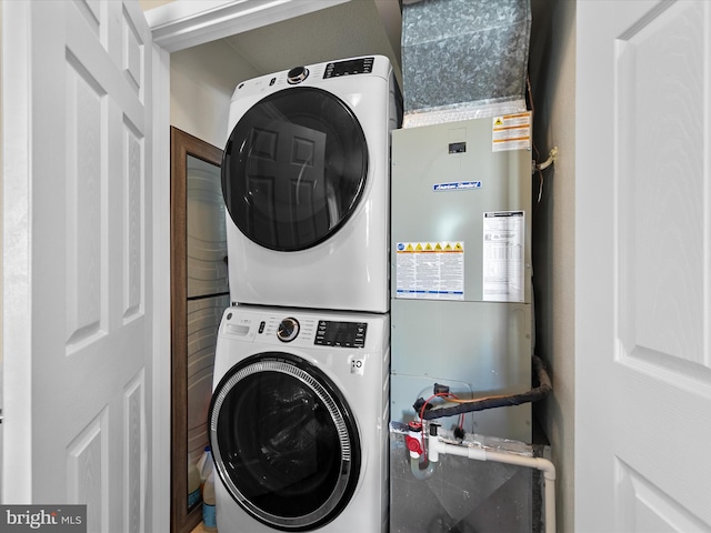 washroom with stacked washer / drying machine