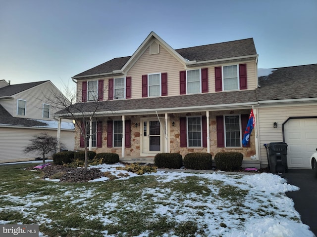 view of front of property featuring a garage