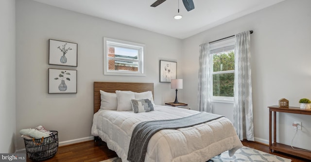 bedroom featuring ceiling fan and dark hardwood / wood-style floors