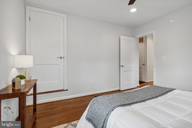 bedroom featuring hardwood / wood-style floors and ceiling fan