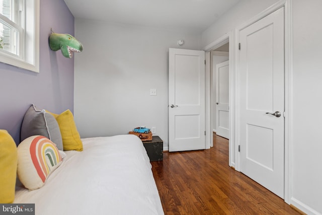 bedroom featuring dark wood-type flooring