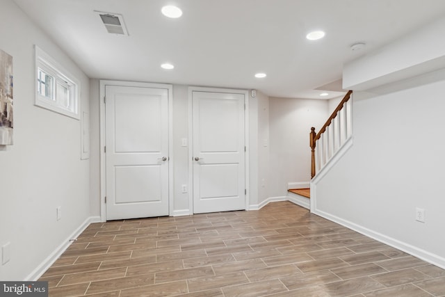 basement featuring light wood-type flooring