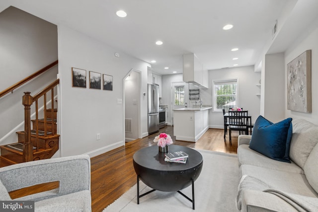 living room with dark hardwood / wood-style flooring