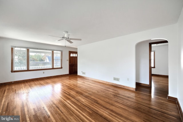 interior space featuring ceiling fan and dark hardwood / wood-style floors