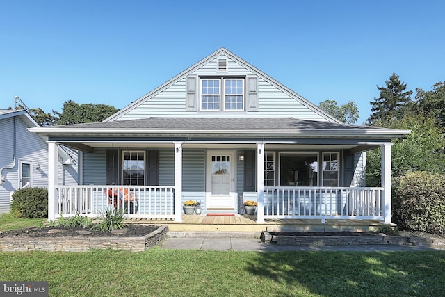 view of front of property with a front lawn and a porch