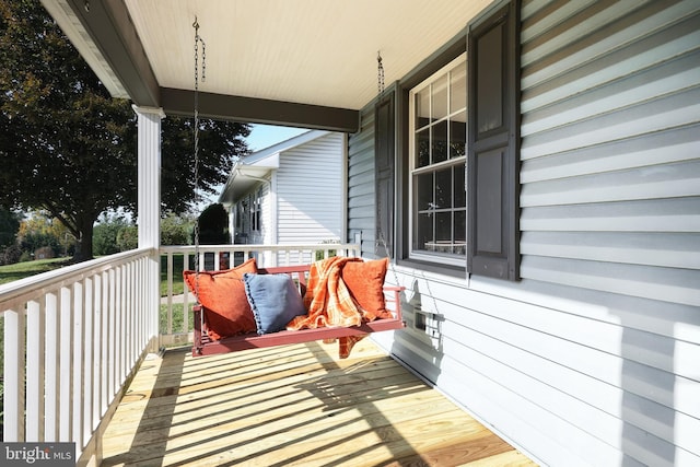 wooden terrace featuring a porch