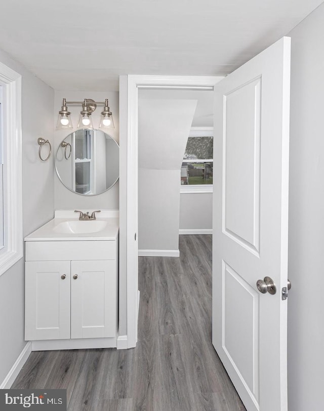 bathroom featuring hardwood / wood-style flooring and vanity