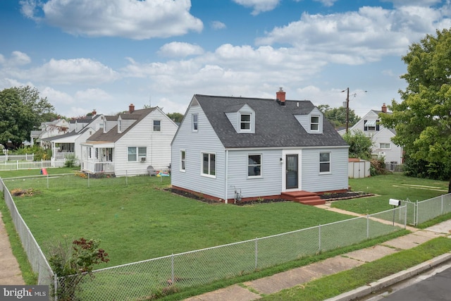 cape cod-style house with a front yard