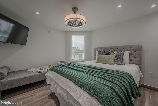 bedroom with hardwood / wood-style floors