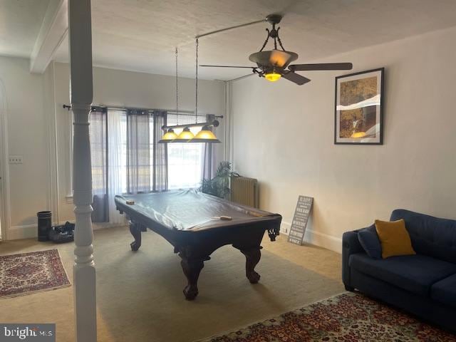 recreation room featuring billiards, ceiling fan, radiator, carpet floors, and beamed ceiling