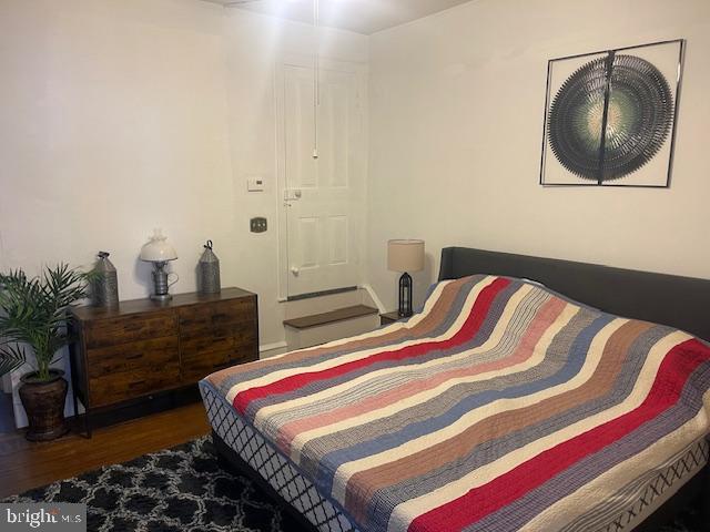 bedroom featuring dark hardwood / wood-style flooring