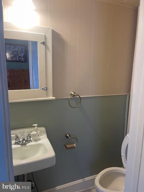 bathroom with toilet and sink