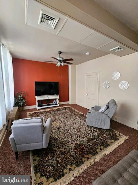 living room with carpet flooring and ceiling fan