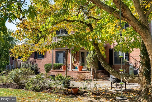 view of property hidden behind natural elements