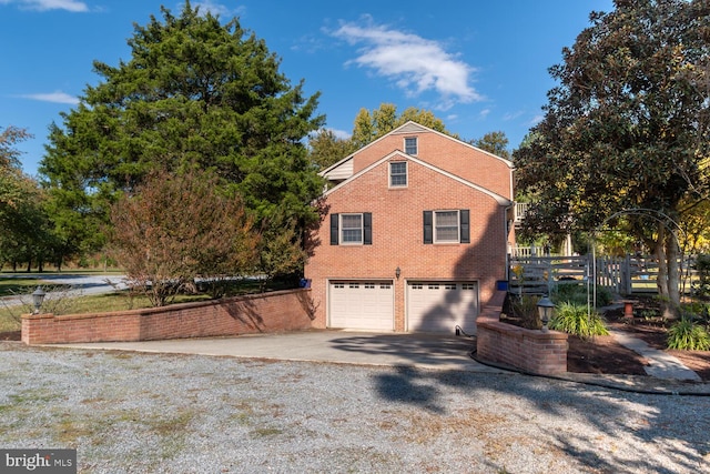 view of side of property featuring a garage