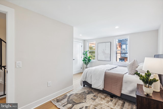 bedroom with hardwood / wood-style flooring