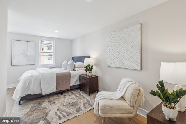 bedroom with wood-type flooring