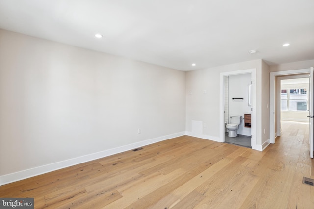 spare room featuring light hardwood / wood-style floors