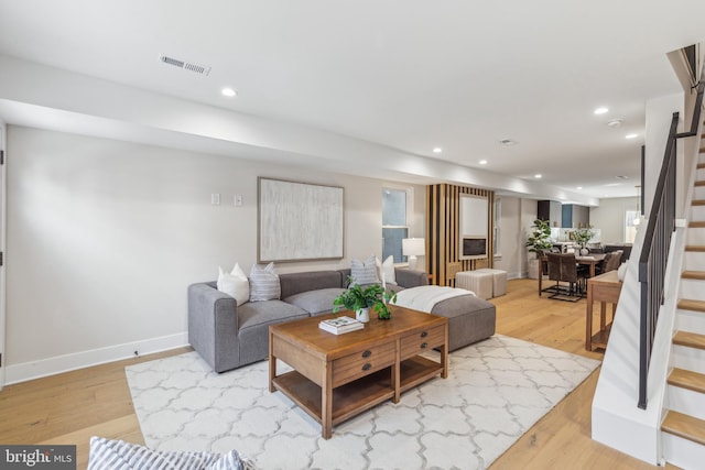 living room with light hardwood / wood-style floors