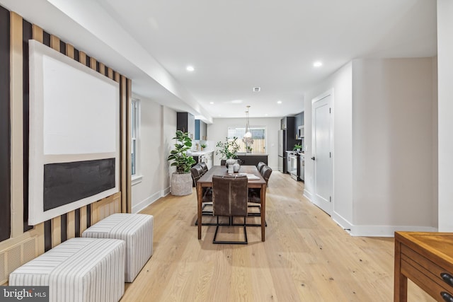 dining area with light hardwood / wood-style flooring