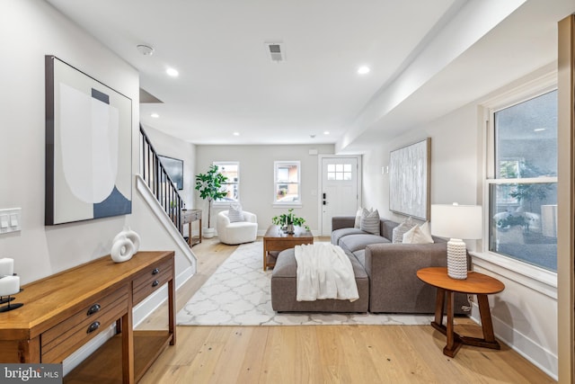 living room with light hardwood / wood-style flooring