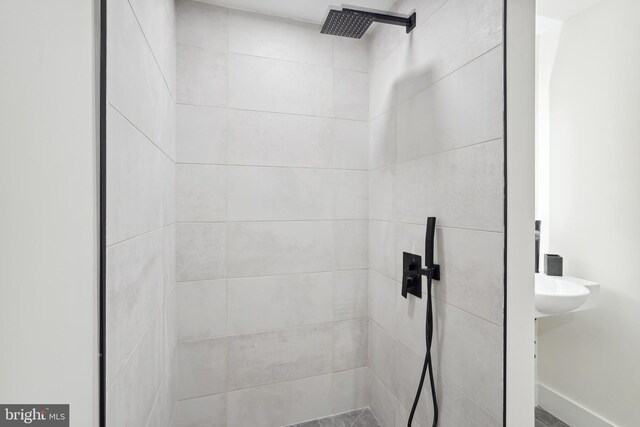 bathroom with a tile shower