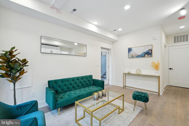 living room with wood-type flooring