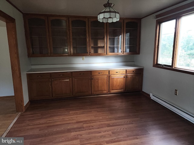 kitchen with pendant lighting, a baseboard radiator, and dark hardwood / wood-style floors