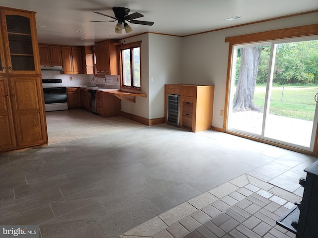 kitchen featuring dishwasher, wine cooler, white range oven, crown molding, and ceiling fan