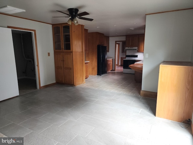 kitchen featuring black refrigerator, white stove, and ceiling fan