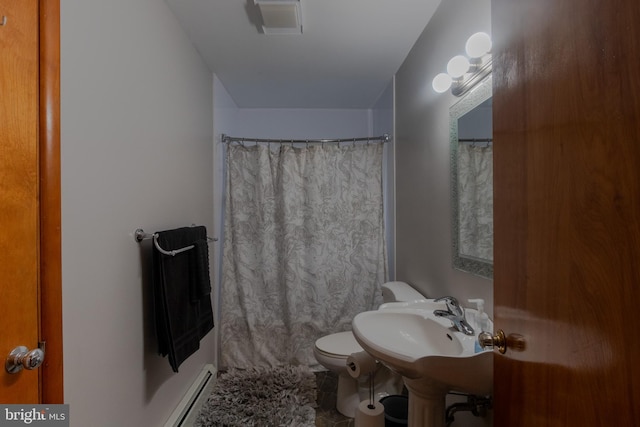 bathroom featuring a baseboard heating unit, toilet, a shower with shower curtain, and sink