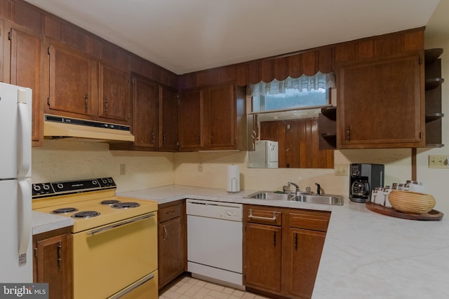 kitchen featuring white appliances and sink