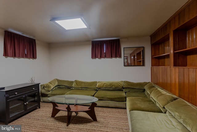 living room with wooden walls