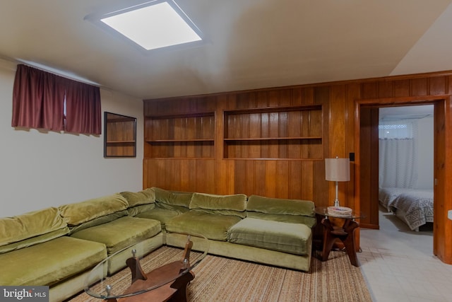 living room with wooden walls