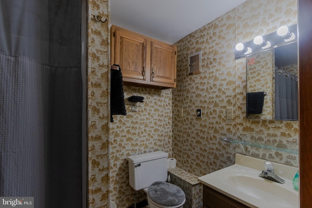 bathroom with tile walls, vanity, toilet, and a shower with curtain