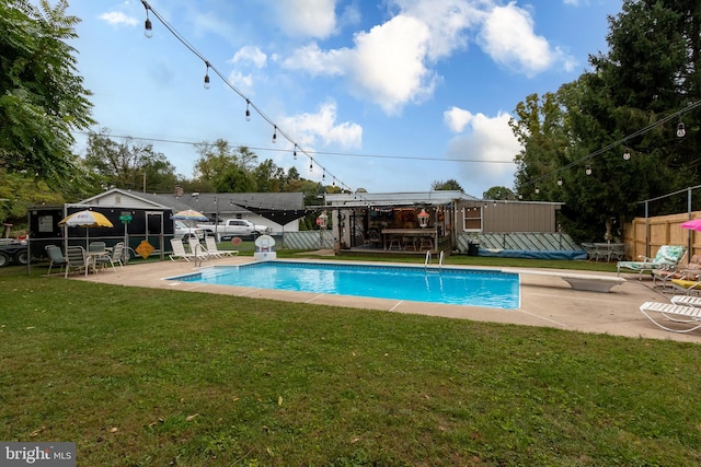 view of swimming pool featuring a lawn, a patio area, and a gazebo