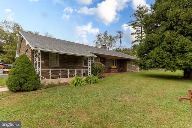 ranch-style house featuring a front lawn