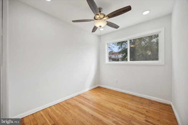 unfurnished room with ceiling fan and wood-type flooring