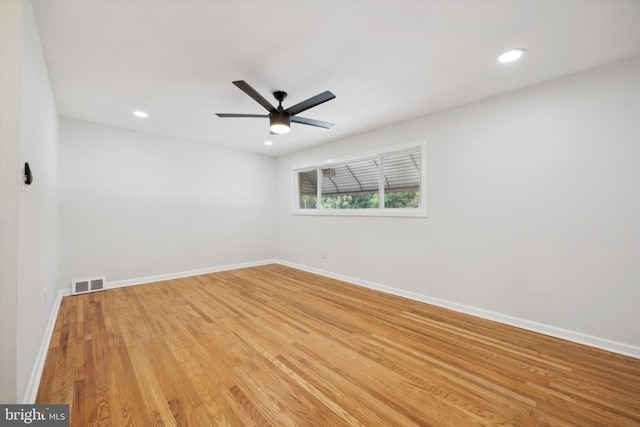 spare room featuring ceiling fan and light wood-type flooring