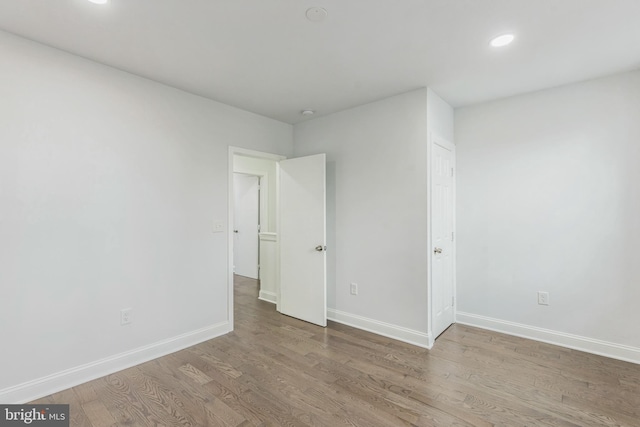 empty room featuring hardwood / wood-style flooring