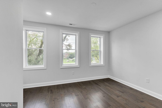 unfurnished room featuring dark hardwood / wood-style floors