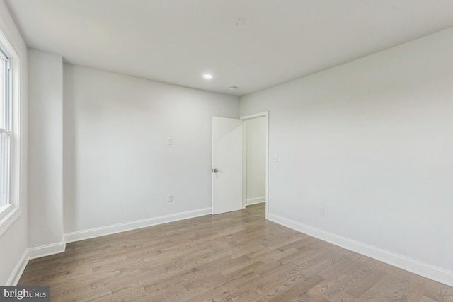 spare room with light hardwood / wood-style flooring