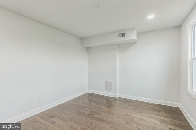 empty room with light hardwood / wood-style flooring