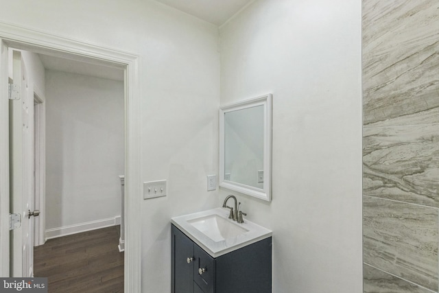 bathroom featuring vanity and hardwood / wood-style flooring