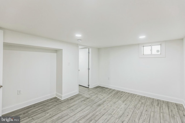 basement featuring light hardwood / wood-style flooring