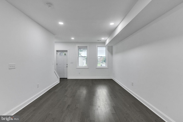 spare room featuring dark hardwood / wood-style floors